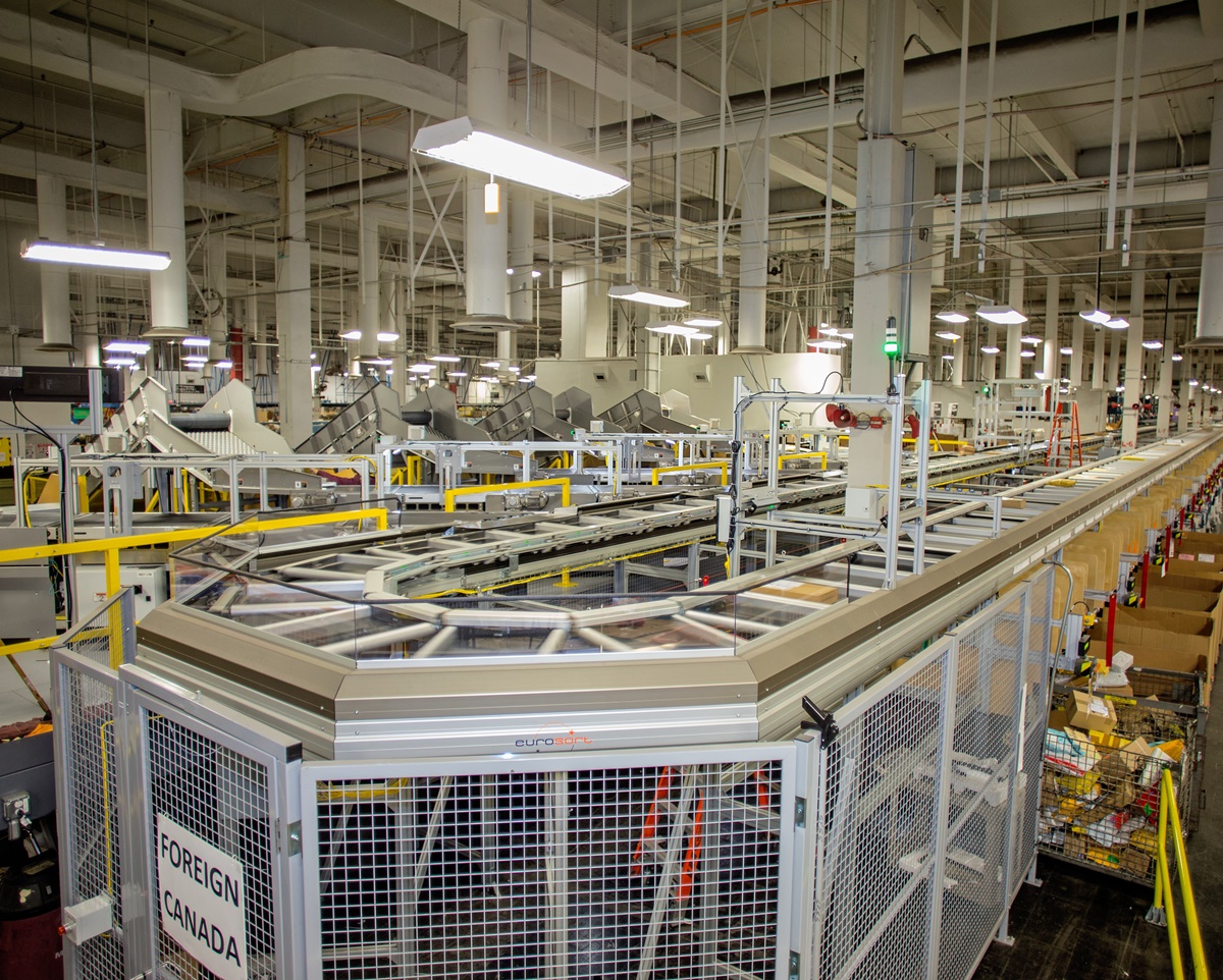 The USPS processes 20 million packages per day on more than 1,000 machines like this Small Package Sorting System.