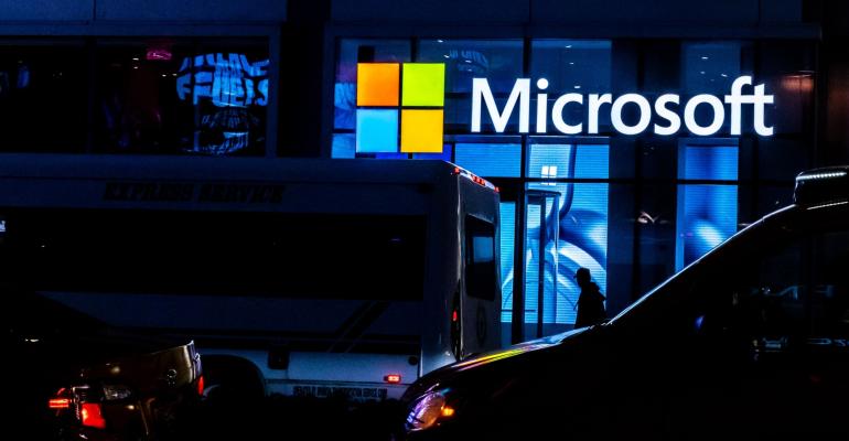 Microsoft logo on building at night