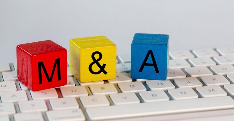 colorful blocks spelling "M&A" on top of a keyboard
