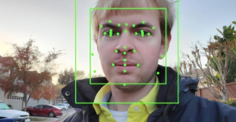Output of an Artificial Intelligence system from Google Vision, performing Facial Recognition on a photograph.