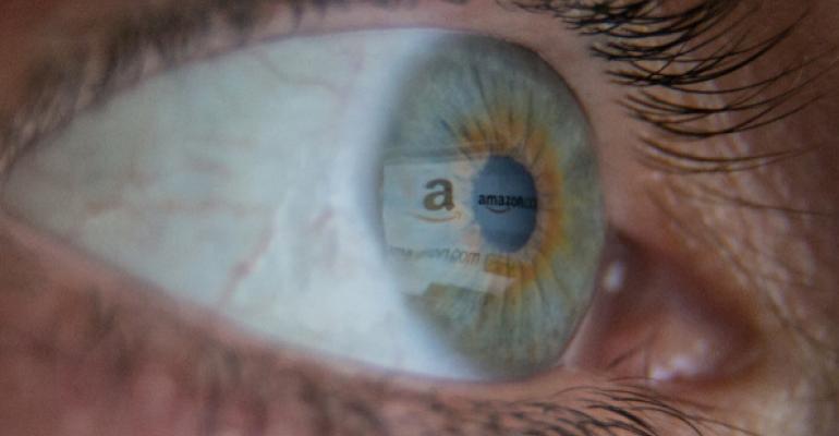 Closeup of eyeball with reflection of Amazon logo