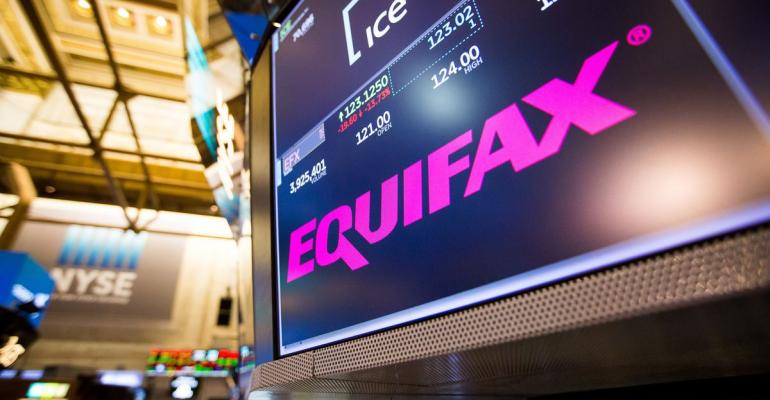 A monitor displays Equifax Inc. signage on the floor of the New York Stock Exchange (NYSE) in New York, U.S., on Friday, Sept. 8, 2017. The dollar fell to the weakest in more than two years, while stocks were mixed as natural disasters damped expectations for another U.S. rate increase this year. Photographer: Michael Nagle/Bloomberg