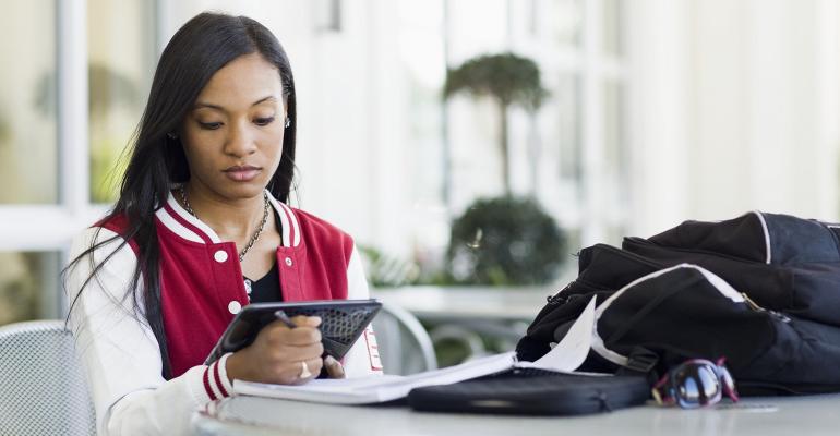 Female African American student using tablet PC