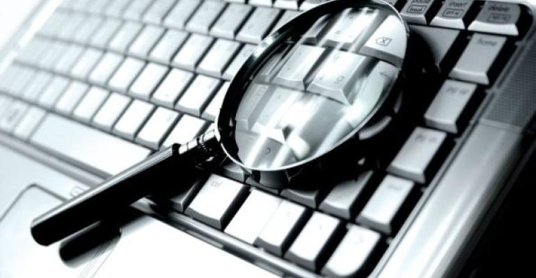 magnifying glass laying on keyboard
