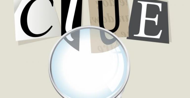 magnifying glass looking at the word clue