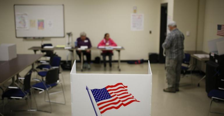 A voting booth stands at a polling station in the Kentucky National Guard Readiness Center in Burlington, Kentucky, U.S. Photographer: Luke Sharrett/Bloomberg