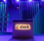 A Slack logo is illuminated on a conference stage at Slack Frontiers 2019