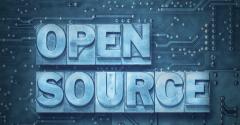 open source phrase made from metallic letterpress blocks on the pc board background