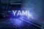YAML inscription against a laptop and code background