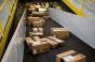 Boxes move along a conveyor belt at the Amazon.com Inc. fulfillment center on Cyber Monday in Robbinsville, New Jersey, U.S. Photographer: Michael Nagle