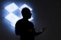 The silhouette of Drew Houston, chief executive officer and co-founder of Dropbox Inc., is seen during an event in San Francisco, California, U.S., on Monday, Jan. 30, 2017. Dropbox announced today that they are releasing Smart Sync, a tool which lets users access terabytes of data without downloading it to their desktop so the information can be viewed on laptops with limited memory. Photographer: David Paul Morris/Bloomberg