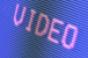 video written in pink on blue screen